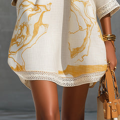 Ivory midi dress with gold abstract print and lace-trimmed hem border