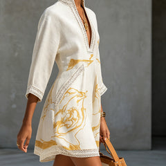 Ivory lace midi dress with V-neck lace trim and gold abstract print panel