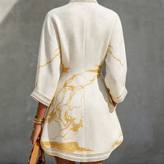 Ivory lace midi dress back view with gold abstract print and lace-trim hem