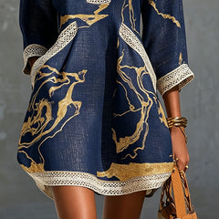 Navy midi dress with gold motif and scalloped lace trim hem; side front view