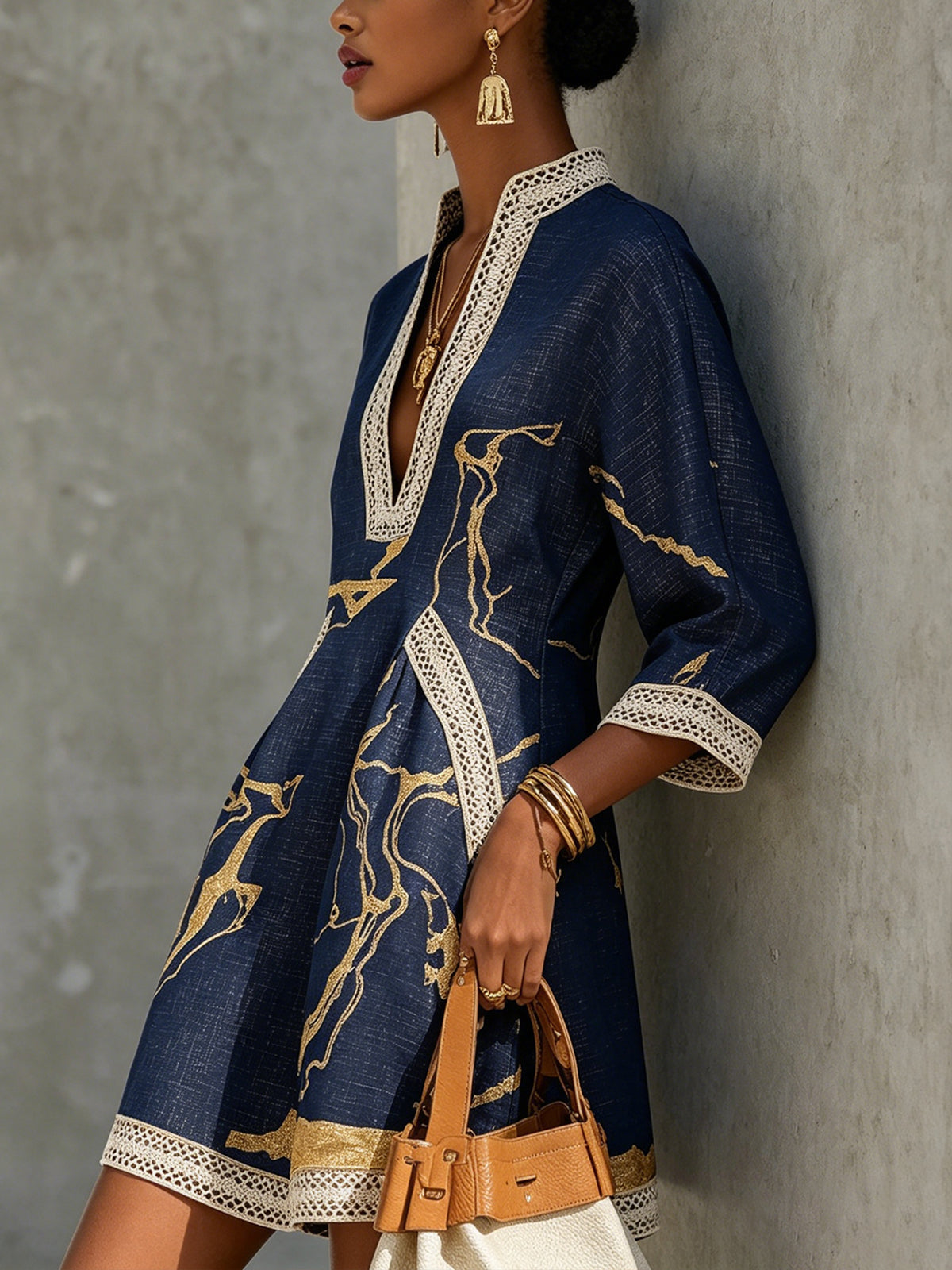 Navy lace midi dress with white lace trim and gold abstract pattern