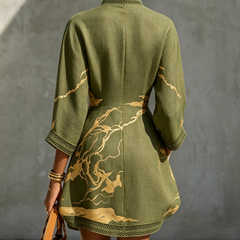 Back view olive green lace midi dress with gold motif embroidery and lace-trim hem