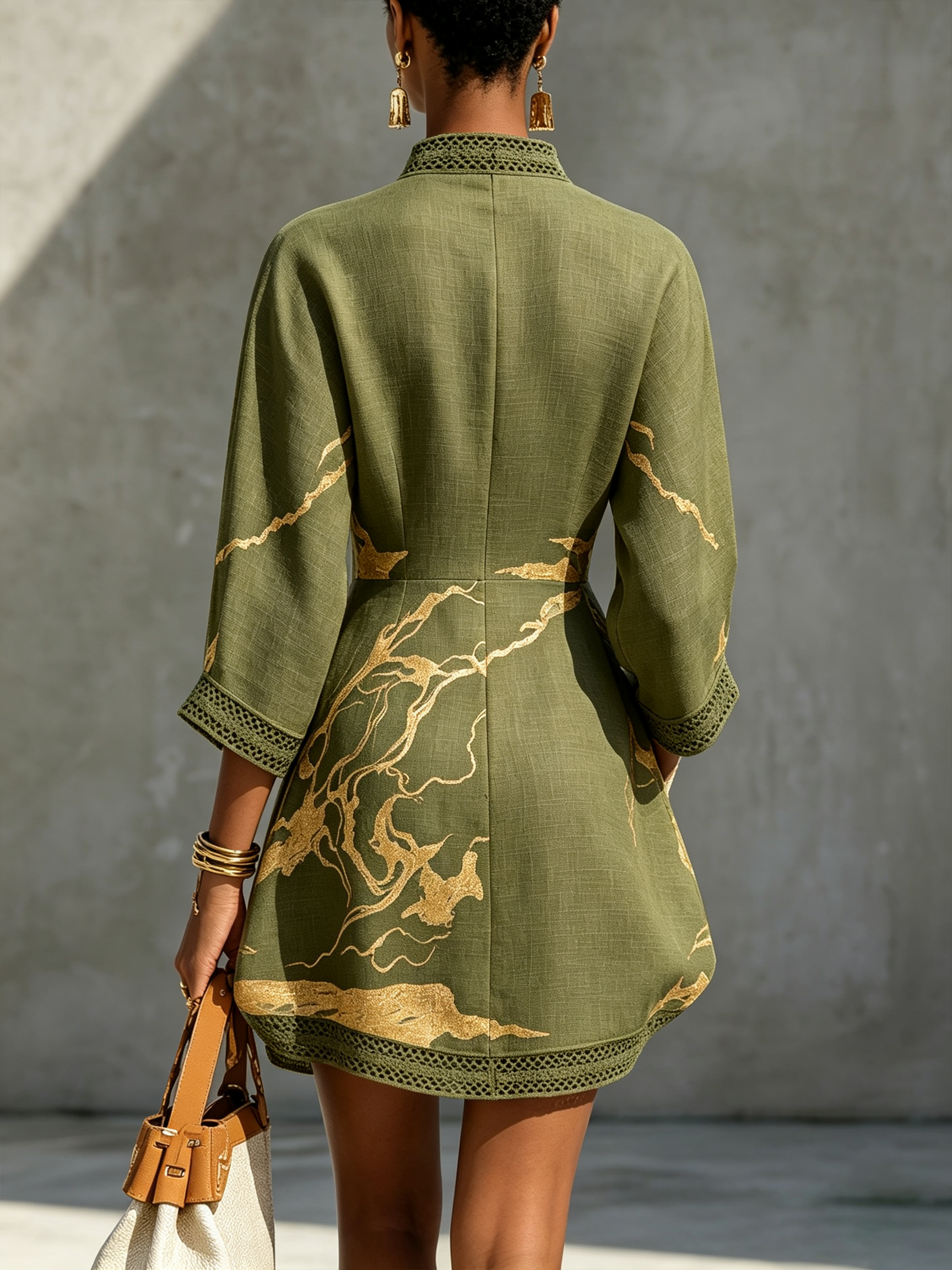 Back view olive green lace midi dress with gold motif embroidery and lace-trim hem