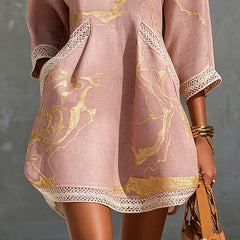 Pink midi dress with gold motif panels and scalloped white lace hem, loose fit