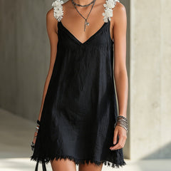 Black floral midi dress with V-neck and shoulder appliques, fringe hem.