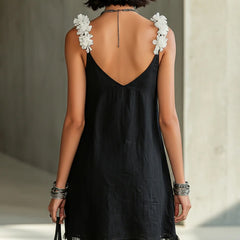 Black midi dress backless V-back with floral shoulder appliques and fringe hem.