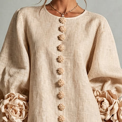 Beige linen midi dress close-up, round neck and floral button trim down front