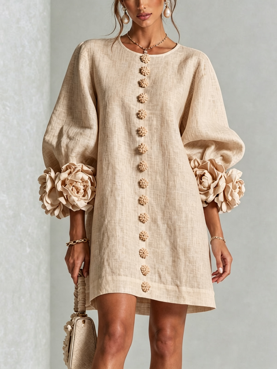 Beige button-front midi dress with round neck, long puff sleeves, and floral trim
