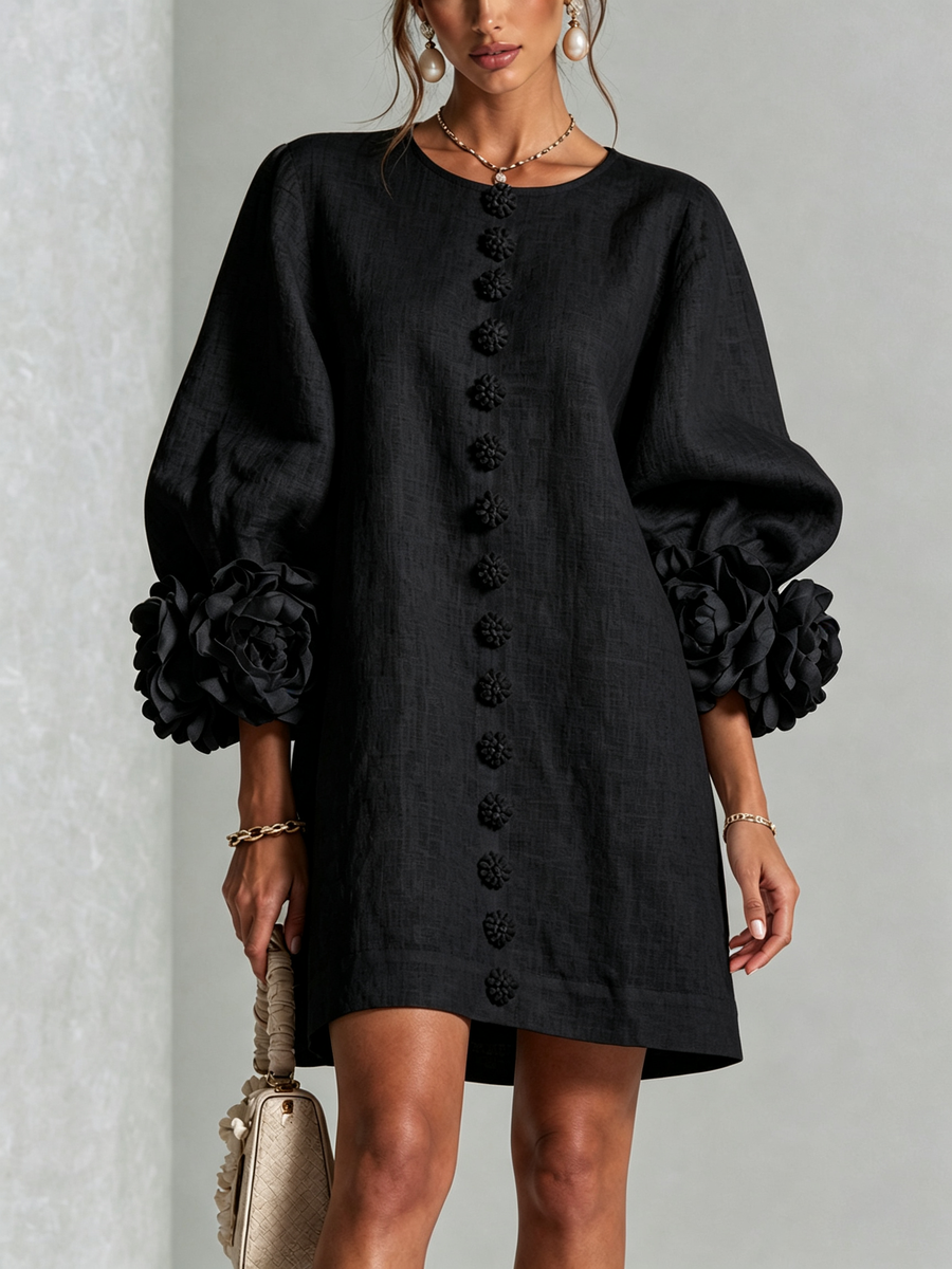 Black button-front midi dress with floral front detail and puff sleeves, rosette cuff