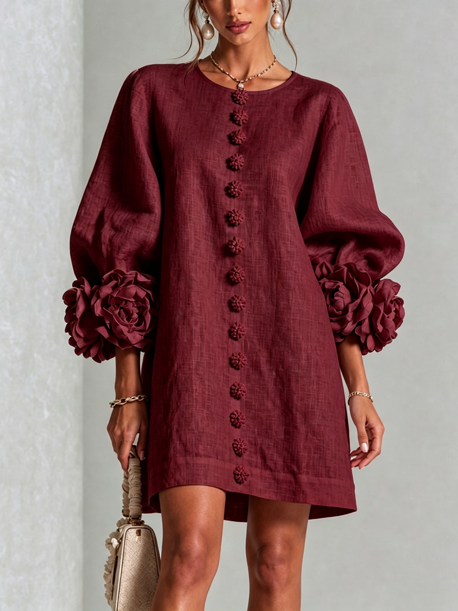 Burgundy linen midi dress with round neckline, long sleeves, and vertical embroidered buttons