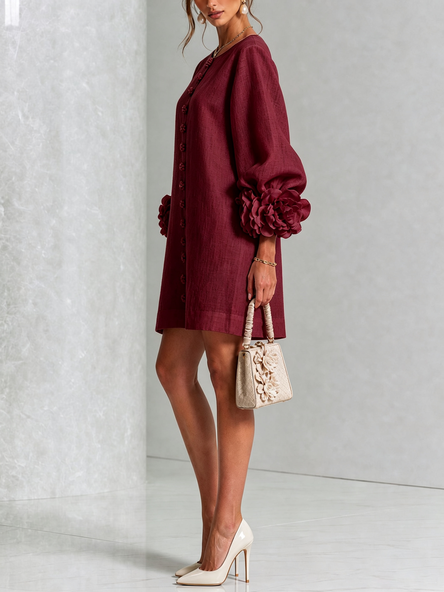 Burgundy midi dress with long puff sleeves and rosette cuff details; side view