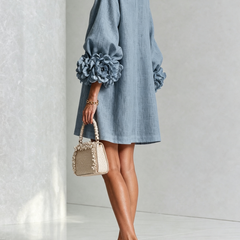 Light blue button-front midi dress with round neckline and rosette puff sleeves