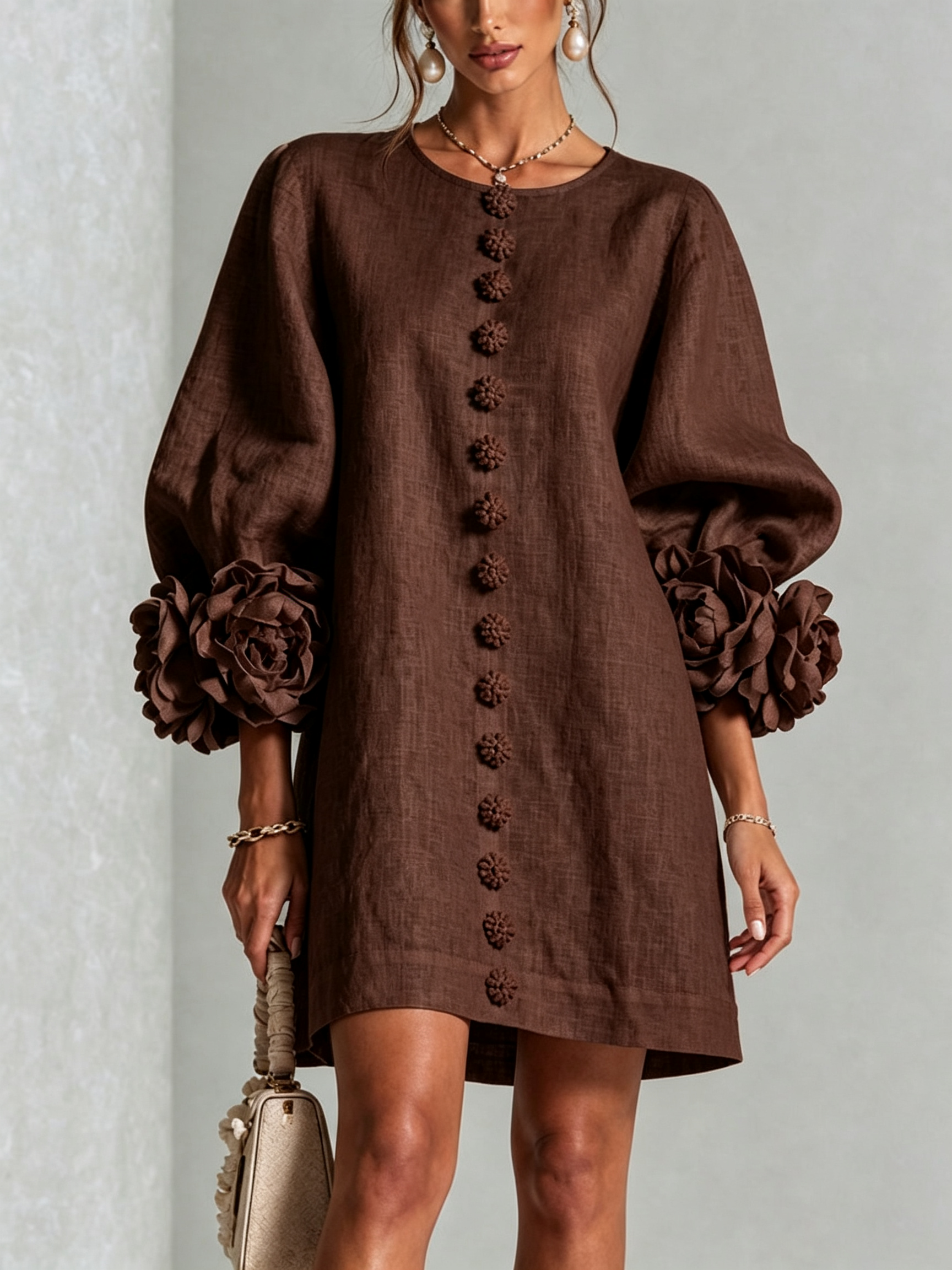 Dark brown button-front midi dress with vertical embroidered buttons and flower cuff details