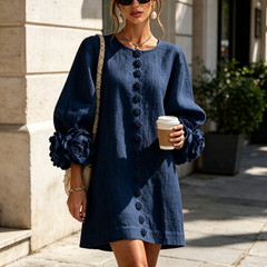 Dark navy button-front midi dress with rosette cuffs, long sleeves, front view