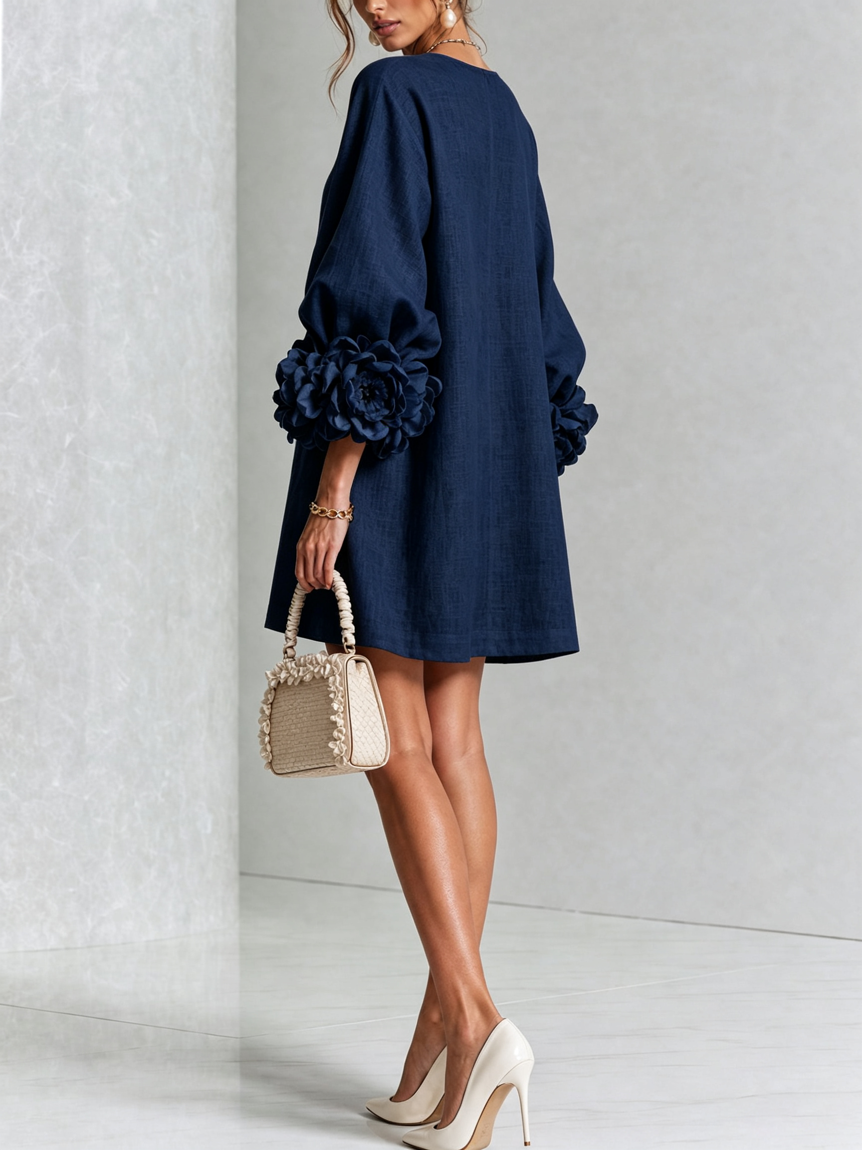 Dark navy button-front midi dress with rosette sleeve detail and curved neckline