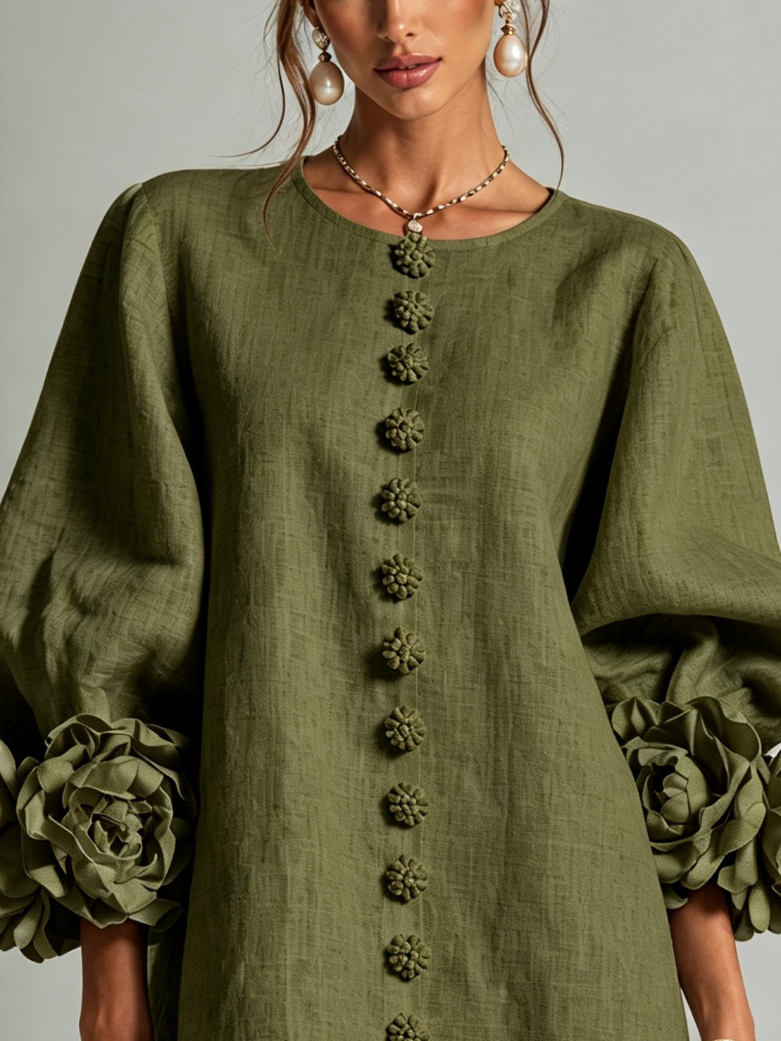 Olive green button-front midi dress with long sleeves and floral-detail buttons
