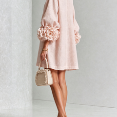 Light pink button-front midi dress with puff sleeves and rosette cuff details