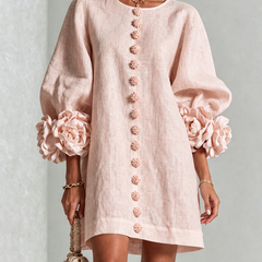 Light pink button-front midi dress with floral rosette embroidery down center