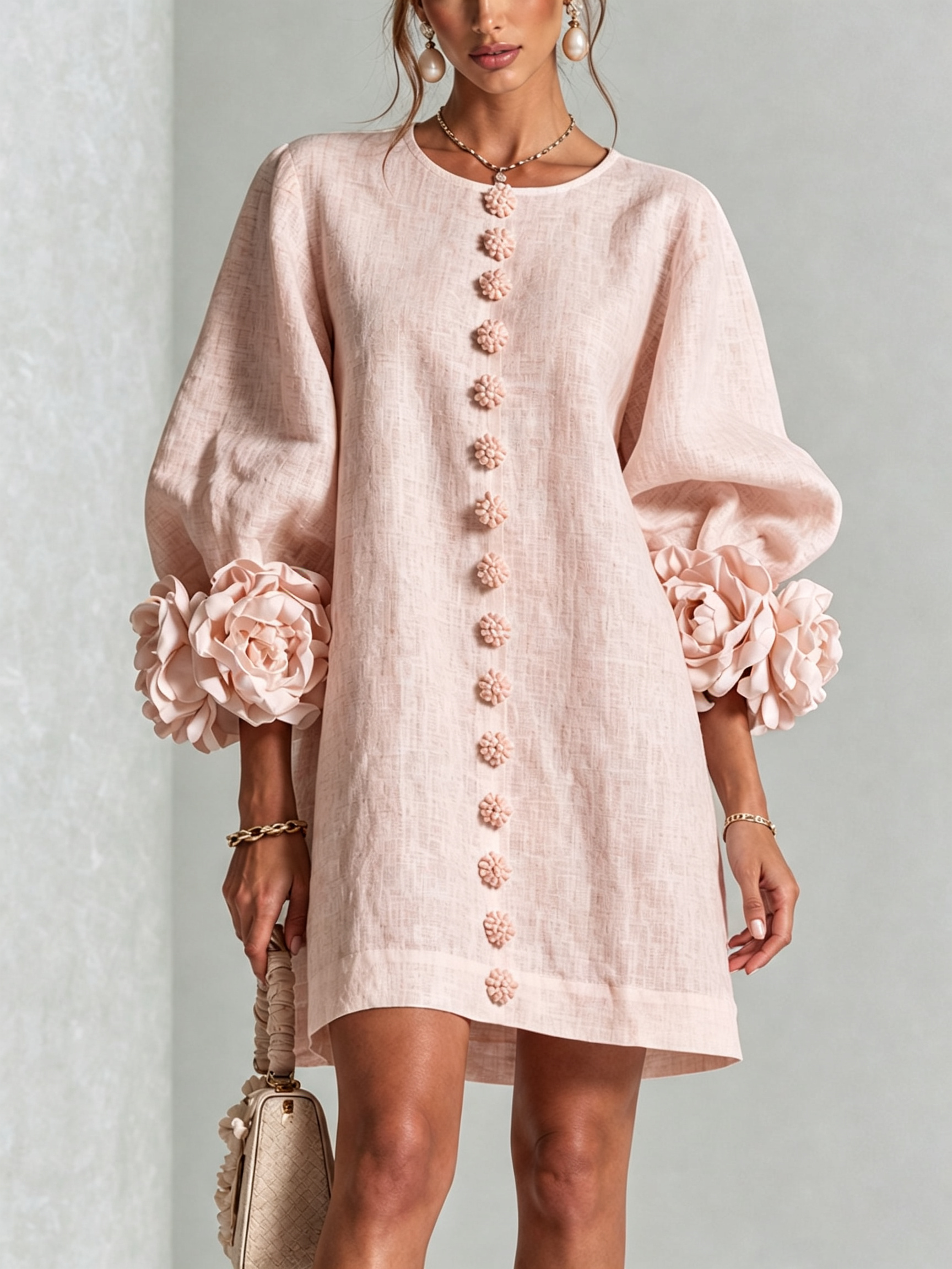 Light pink button-front midi dress with floral rosette embroidery down center
