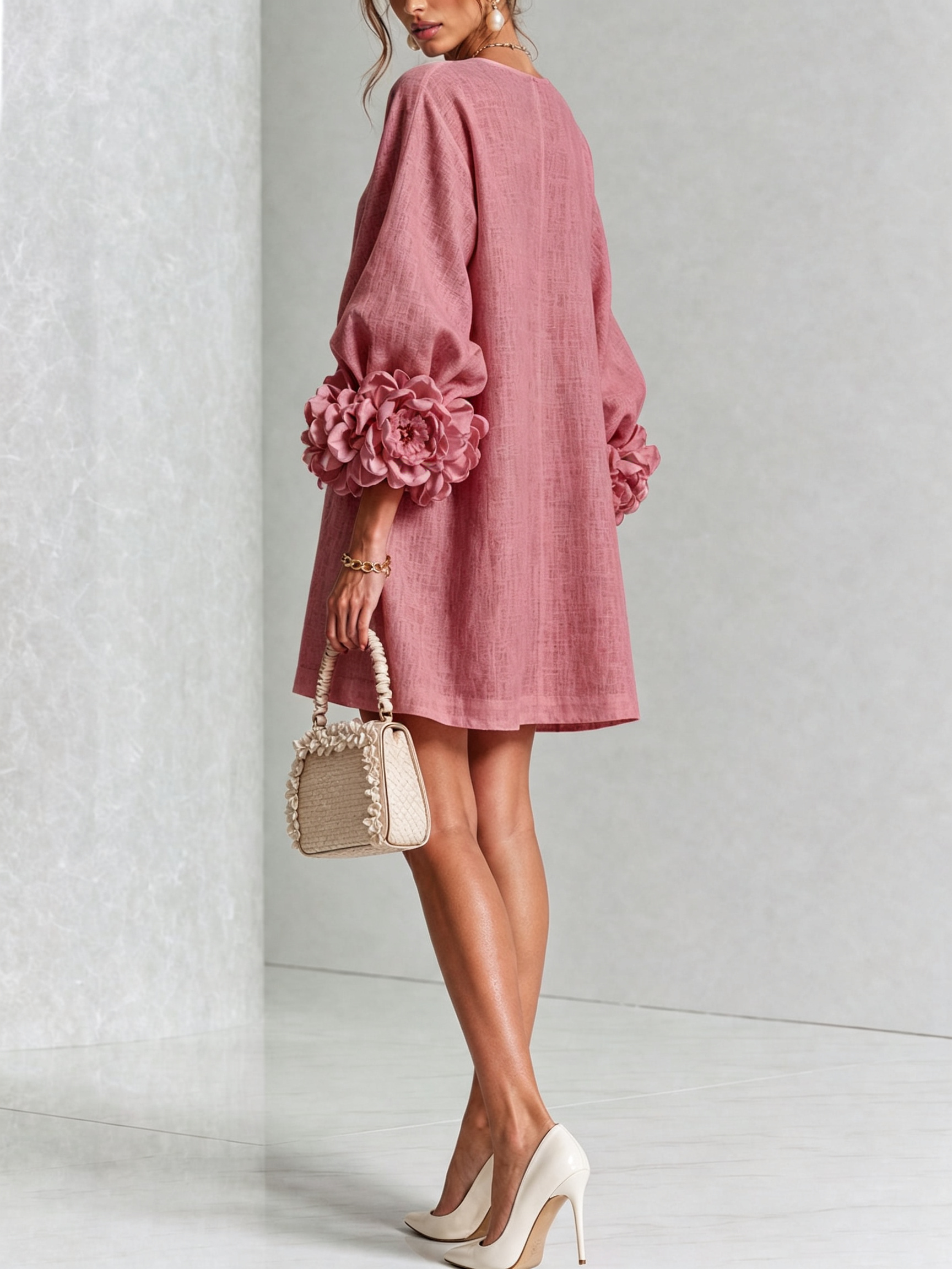 Dusty rose button-front midi dress, side view, with rosette puff sleeves and buttons