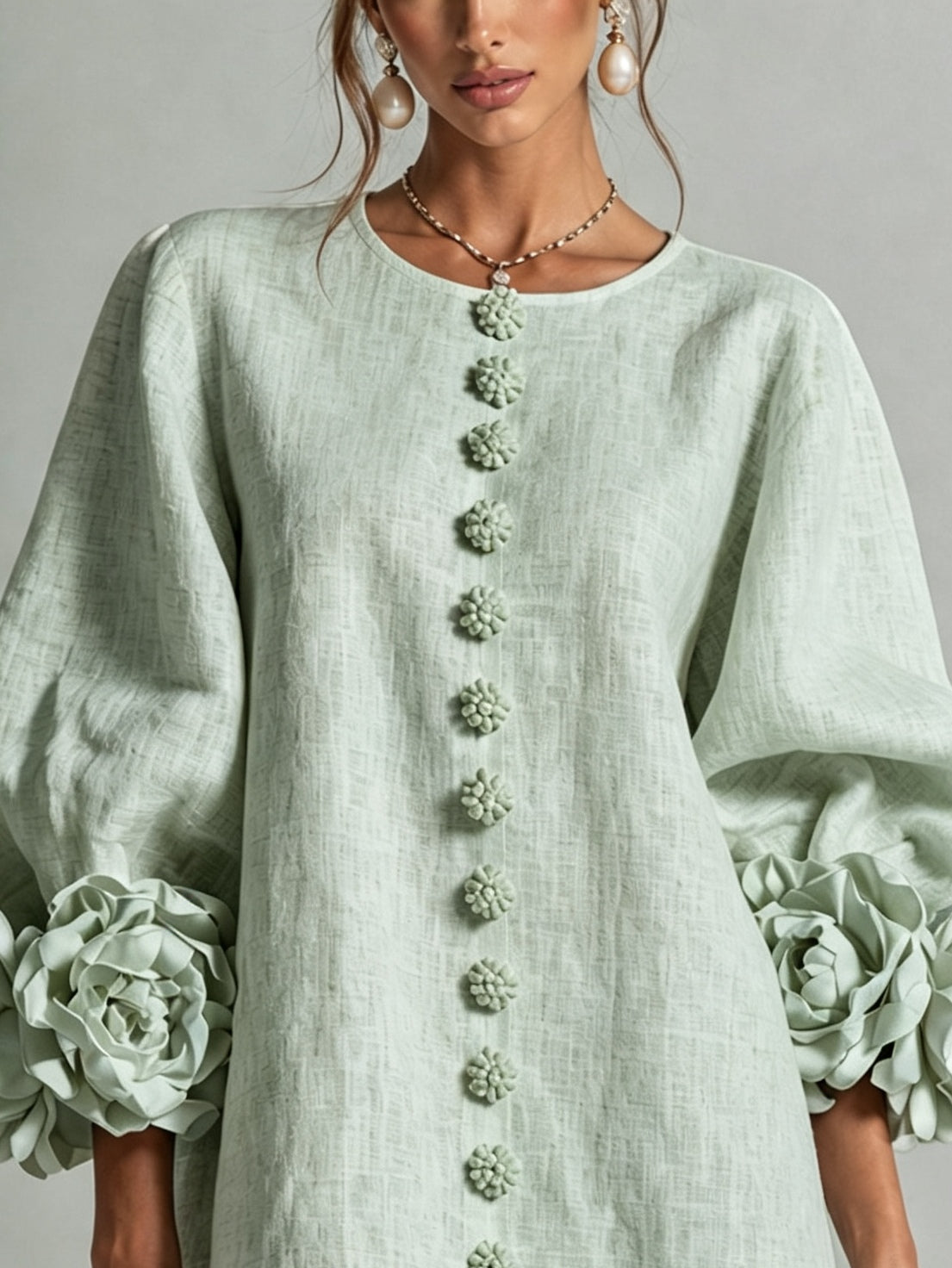 Sage green midi dress front view with round neck and vertical floral embroidery