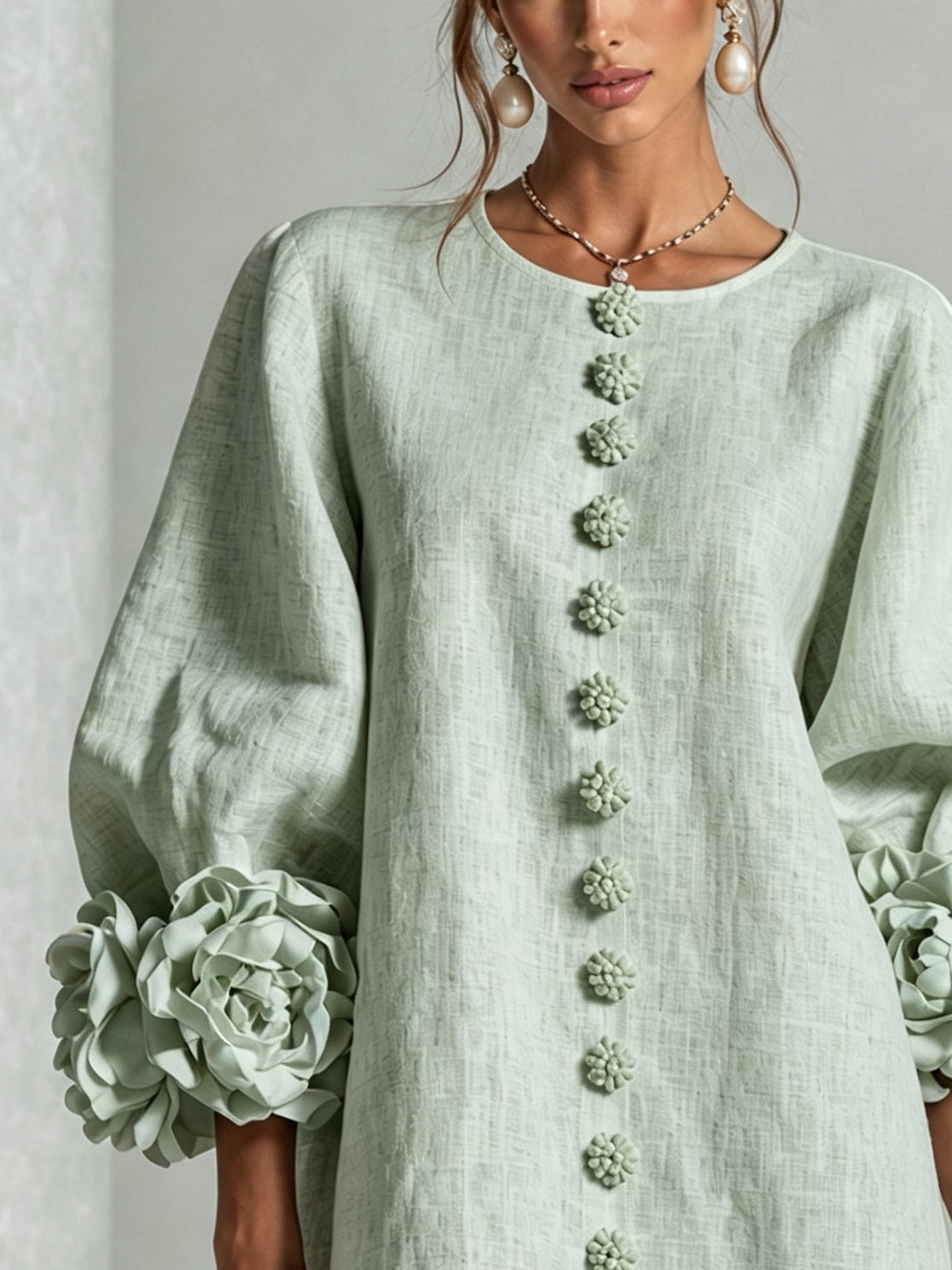 Sage green midi dress with round neck, long puff sleeves, vertical floral embroidery