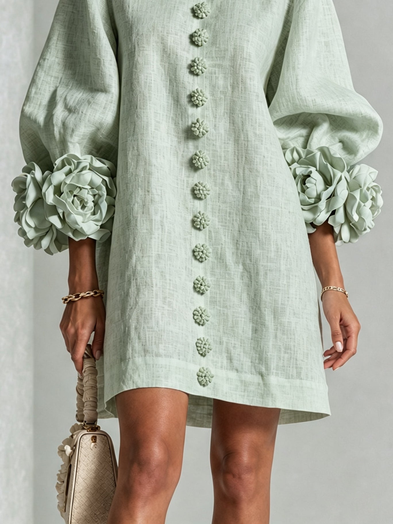 Sage green midi dress with rosette puff sleeves and vertical floral embroidery placket