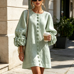 Sage green midi dress with round neck, button-front floral embroidery, large rosette sleeve cuffs