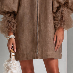 Brown zip-front midi dress with ruffled sleeve cuffs and straight hem.