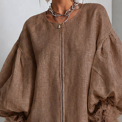 Brown zip-front midi dress with round neckline and wide balloon sleeves with ruffle cuffs.