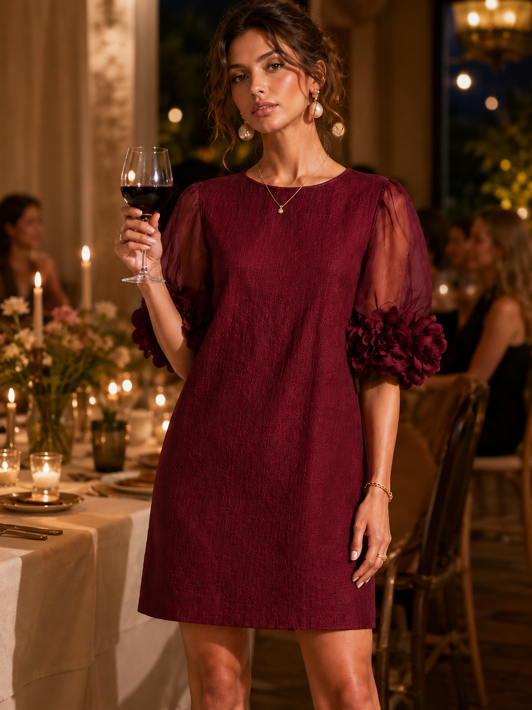 Burgundy puff-sleeve midi dress with sheer sleeves and pom-pom rosette cuffs