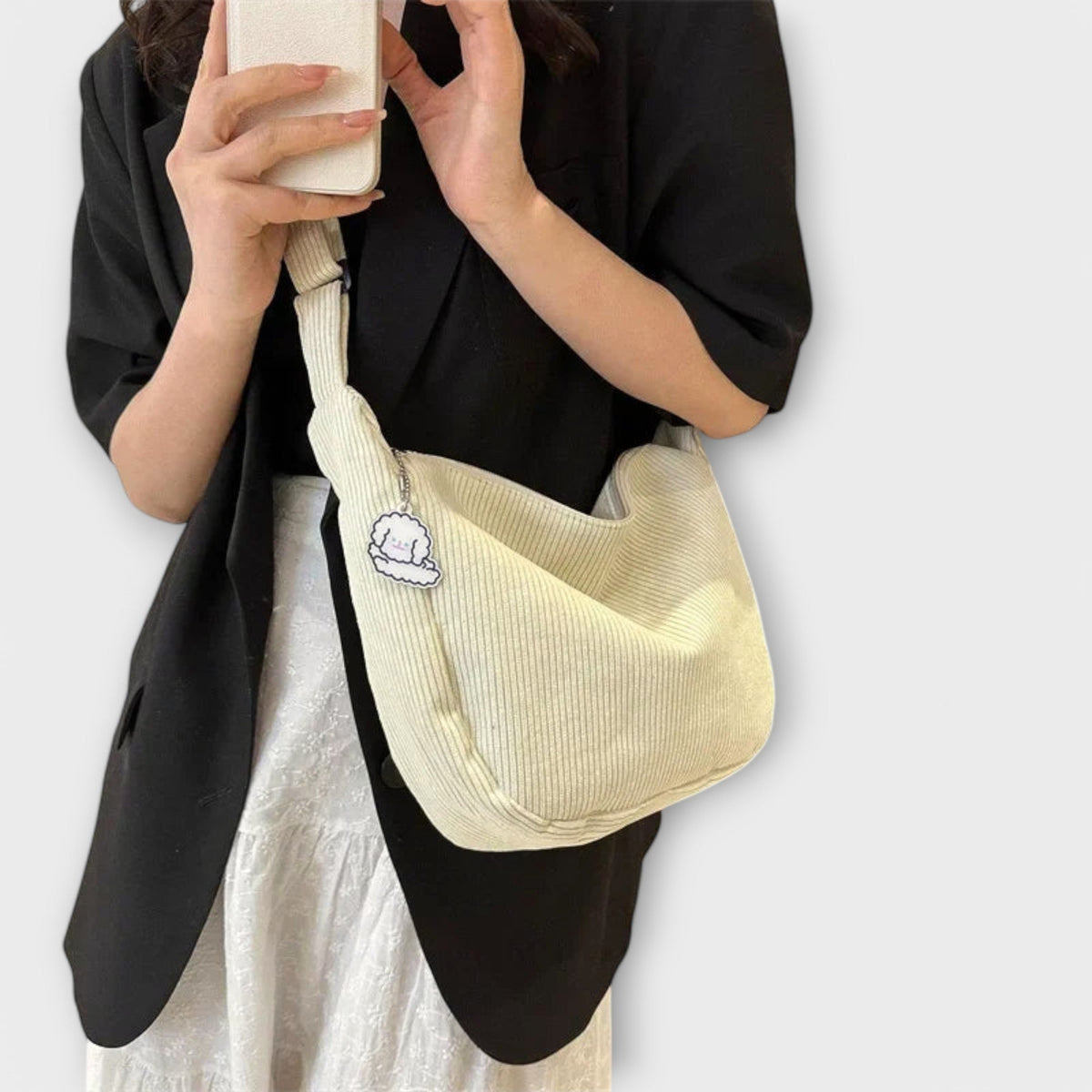 Alexa women’s shoulder bag, cream corduroy hobo shape with cloud charm patch