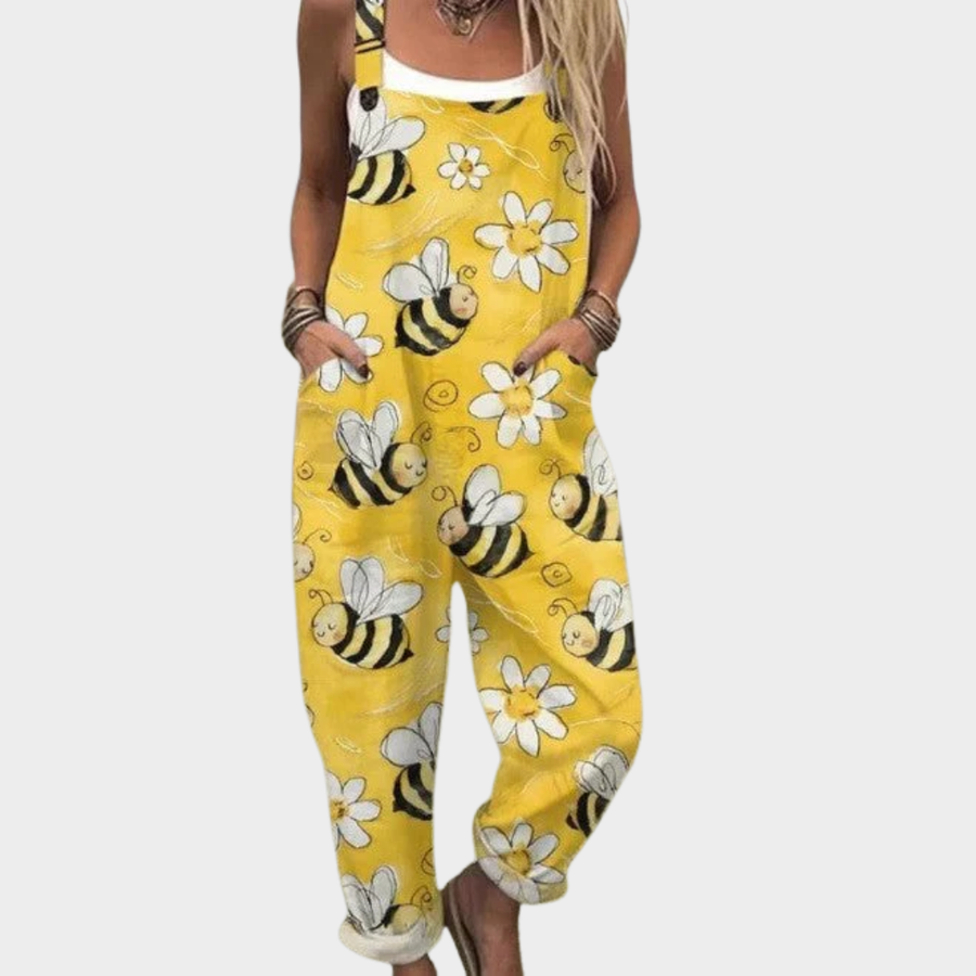 Yellow printed overalls with bee and flower pattern, sleeveless bib-style
