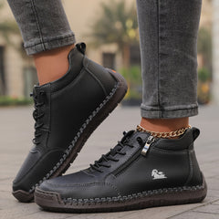 Scarpe ortopediche nere con lacci e cerniera laterale, cuciture decorative