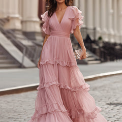 Pink ruffled V-neck tiered maxi dress with short flutter sleeves and flowing tiered hem
