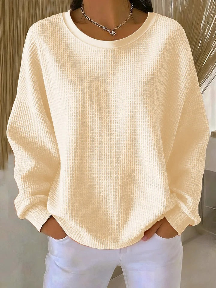 NYLA classic sweater in apricot waffle-knit, crewneck, long sleeves with ribbed cuffs.
