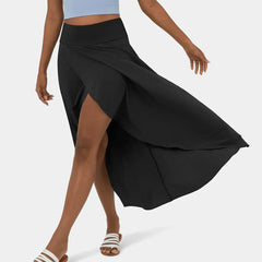 Black midi skirt with draped front slit and layered asymmetric hem