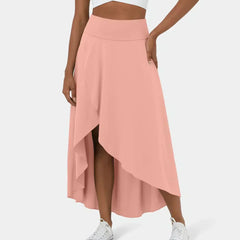 Blush pink midi skirt with draped front slit and asymmetric layered hem