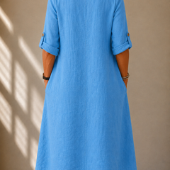 Blue V-back midi dress with three-quarter sleeves, relaxed A-line silhouette
