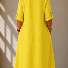 Back view of yellow relaxed V-neck midi dress with 3/4 sleeves