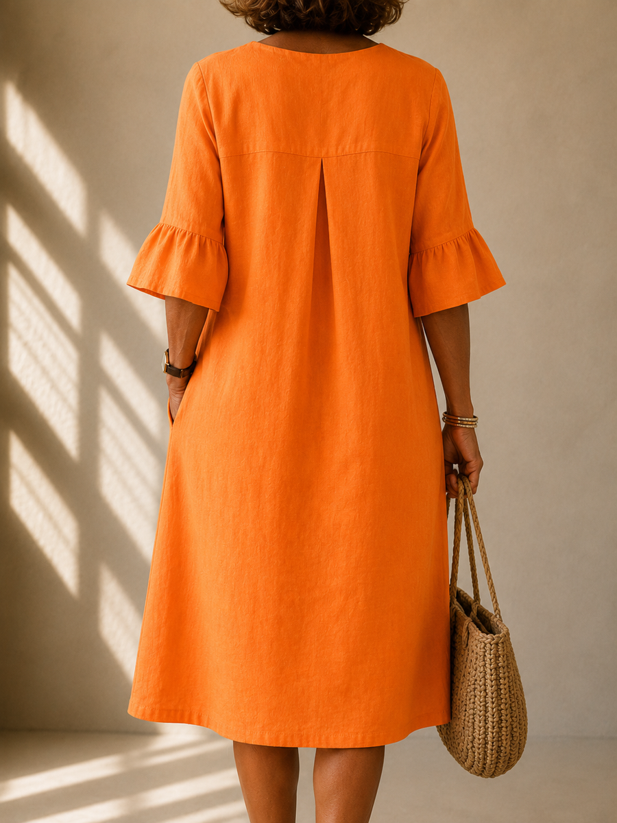 Orange midi dress with back pleat detail and short ruffled sleeves