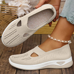 Beige knit slip-on sneakers with side cutouts and white cushioned sole