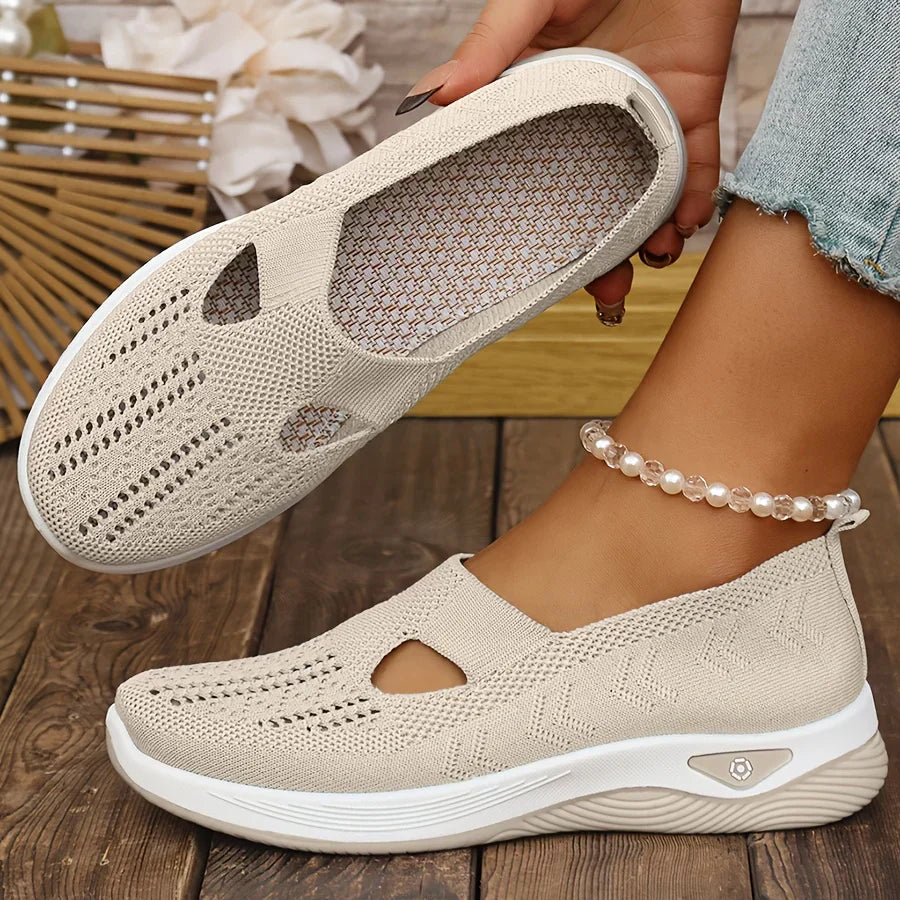 Beige knit slip-on sneakers with side cutouts and white cushioned sole
