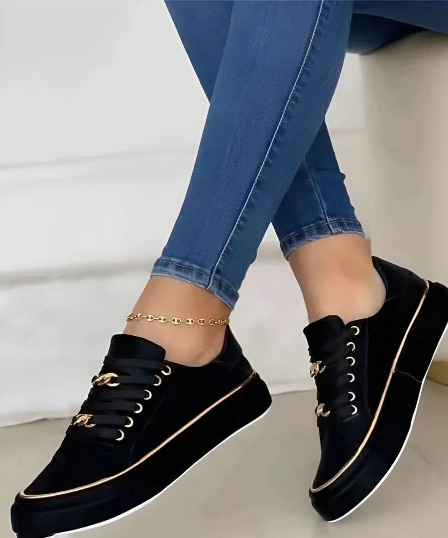 Women’s orthopaedic trainers, black with gold trim and lace-up eyelet details