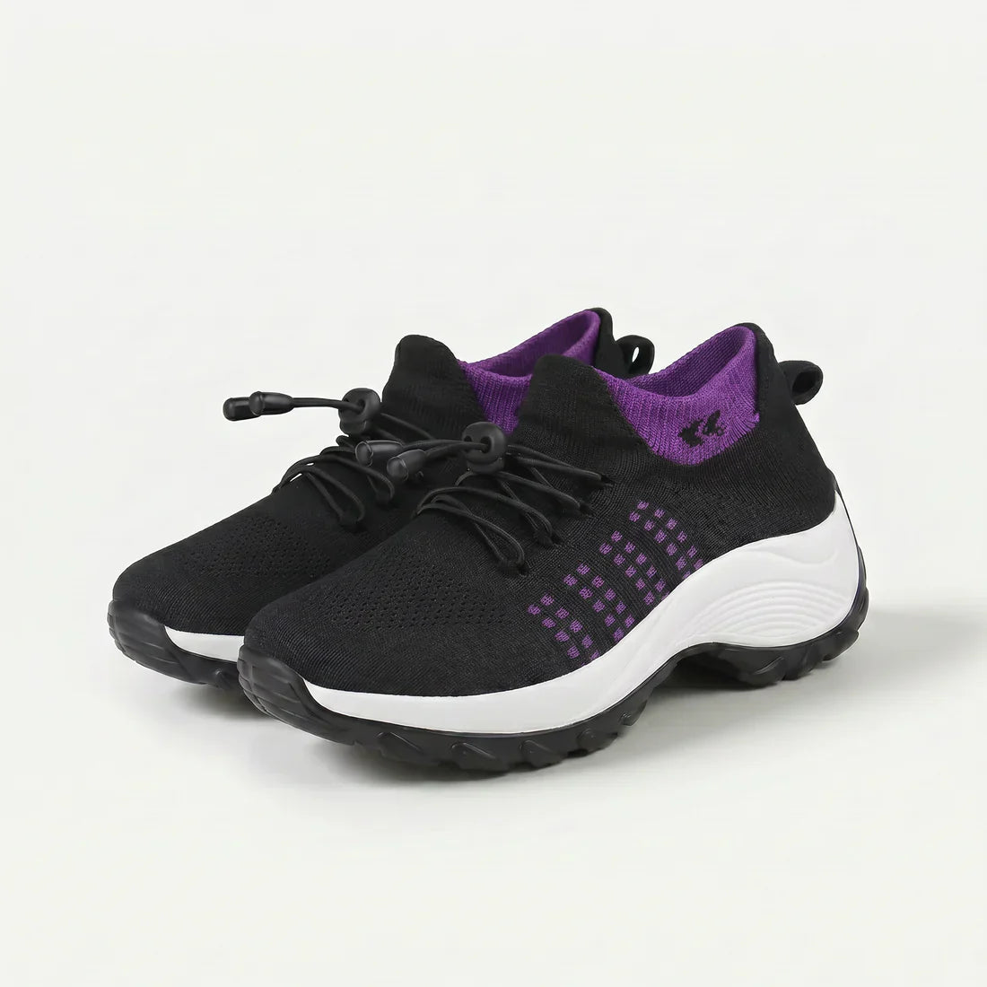 Scarpa comfort ortopedica nera con dettagli viola e suola bianca ammortizzata.