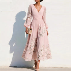 Vestito midi rosa con scollo a V, maniche a sbuffo trasparenti e stampa floreale