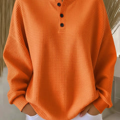 Orange waffle henley sweatshirt with buttoned placket and long sleeves