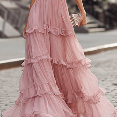 Pink tiered maxi dress with ruffled V-neck, short flutter sleeves and layered skirt