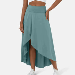Asymmetric midi skirt in teal with high-low hem and draped side panel