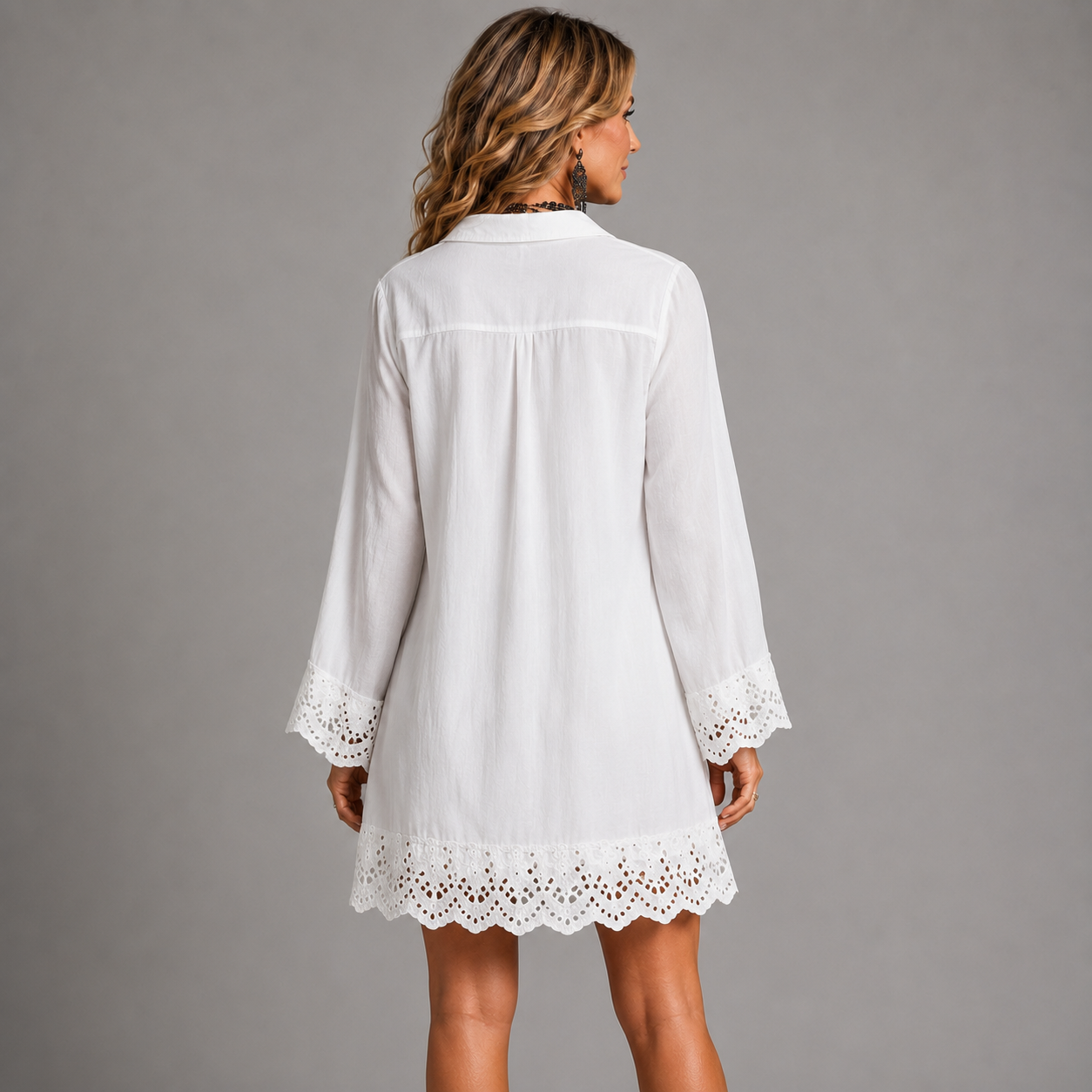 White shirt mini dress back view with eyelet lace hem and sleeve cuffs